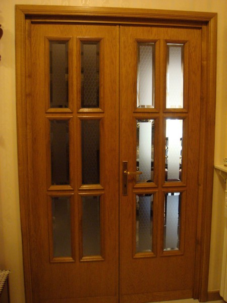 Porte interne in legno con inserti in acciaio